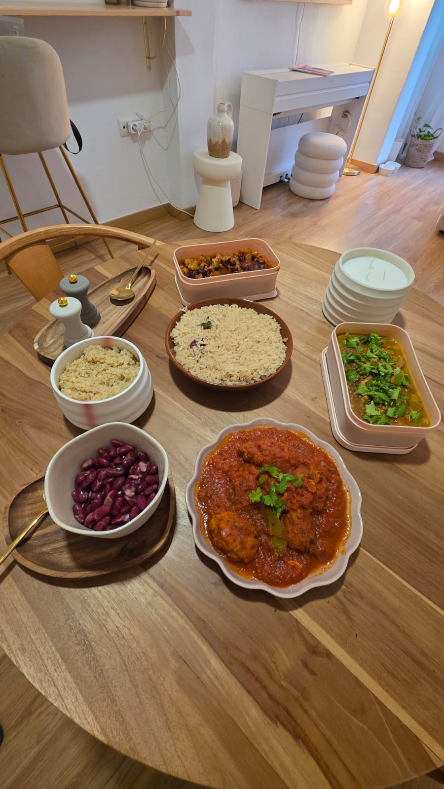 Plant-based batch cooking preparations laid out on a home kitchen table